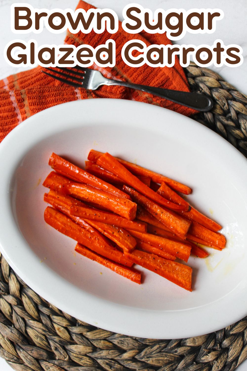 roasted carrots in a white bowl.