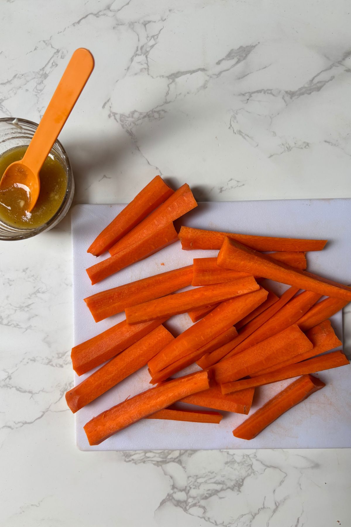 carrots on a cutting board with glaze.