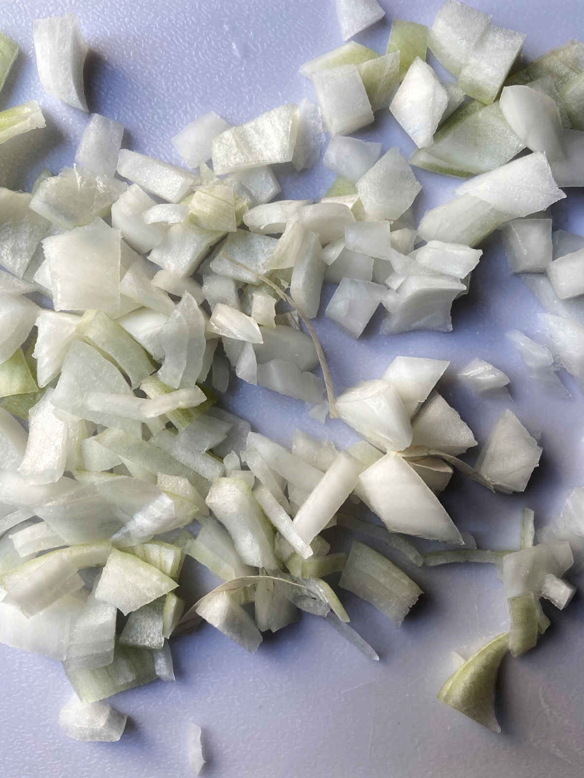 Onions chopped on the cutting board.