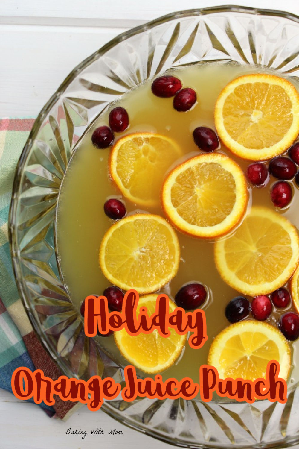 bowl of holiday punch with oranges and cranberries. 