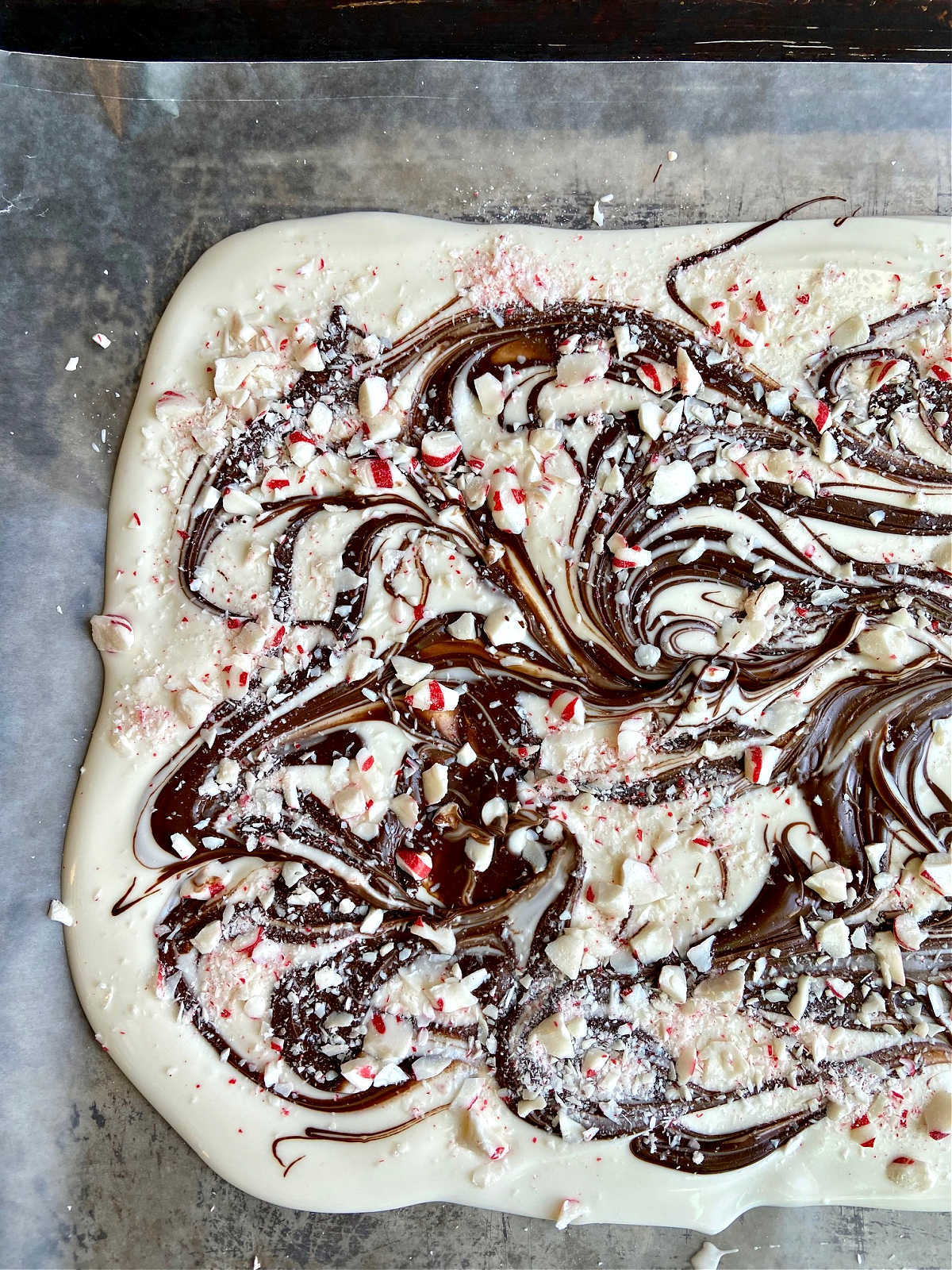 chocolate and vanilla almond bark mix together with peppermint on waxed paper. 