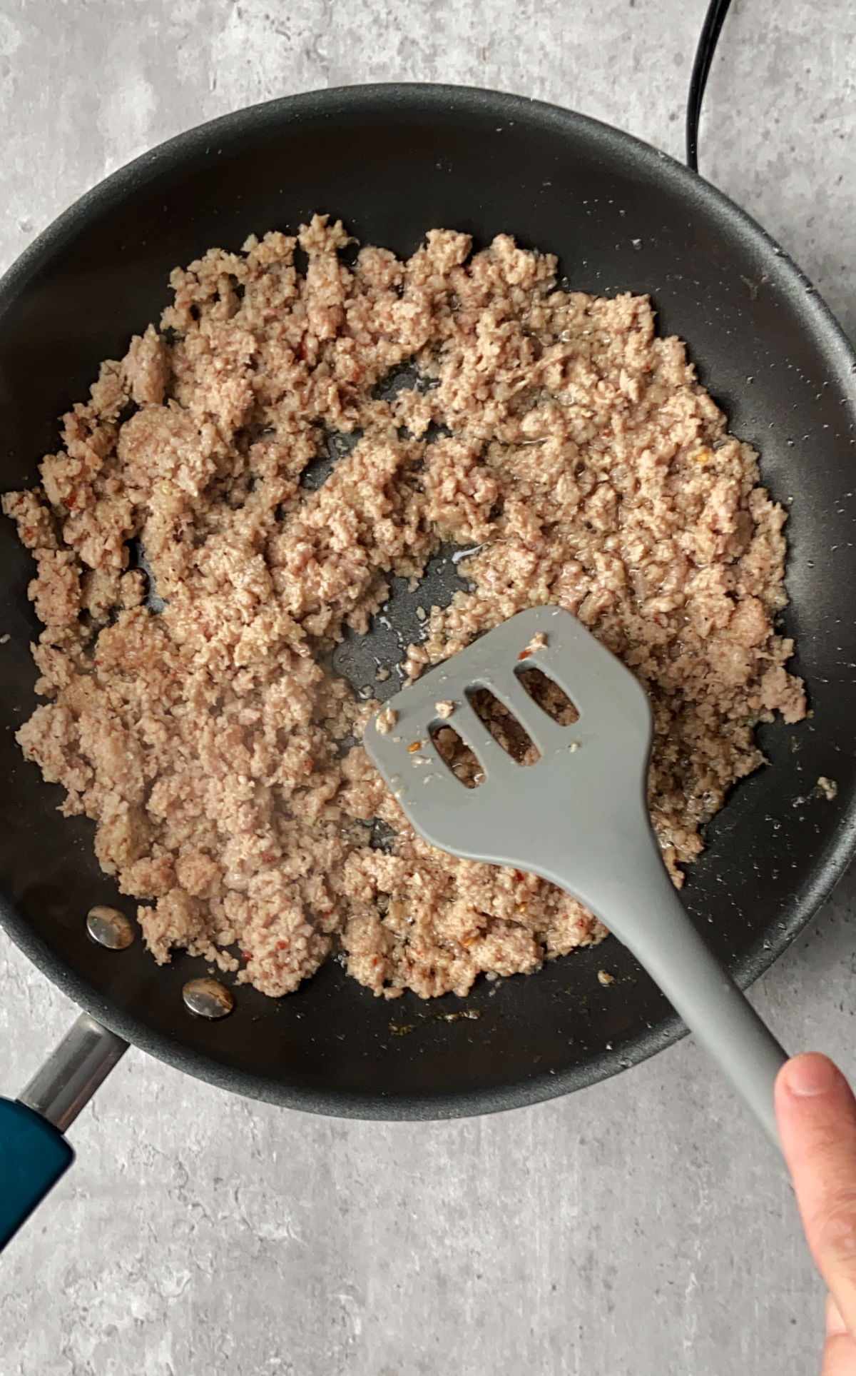 Cooked sausage in a frying pan.