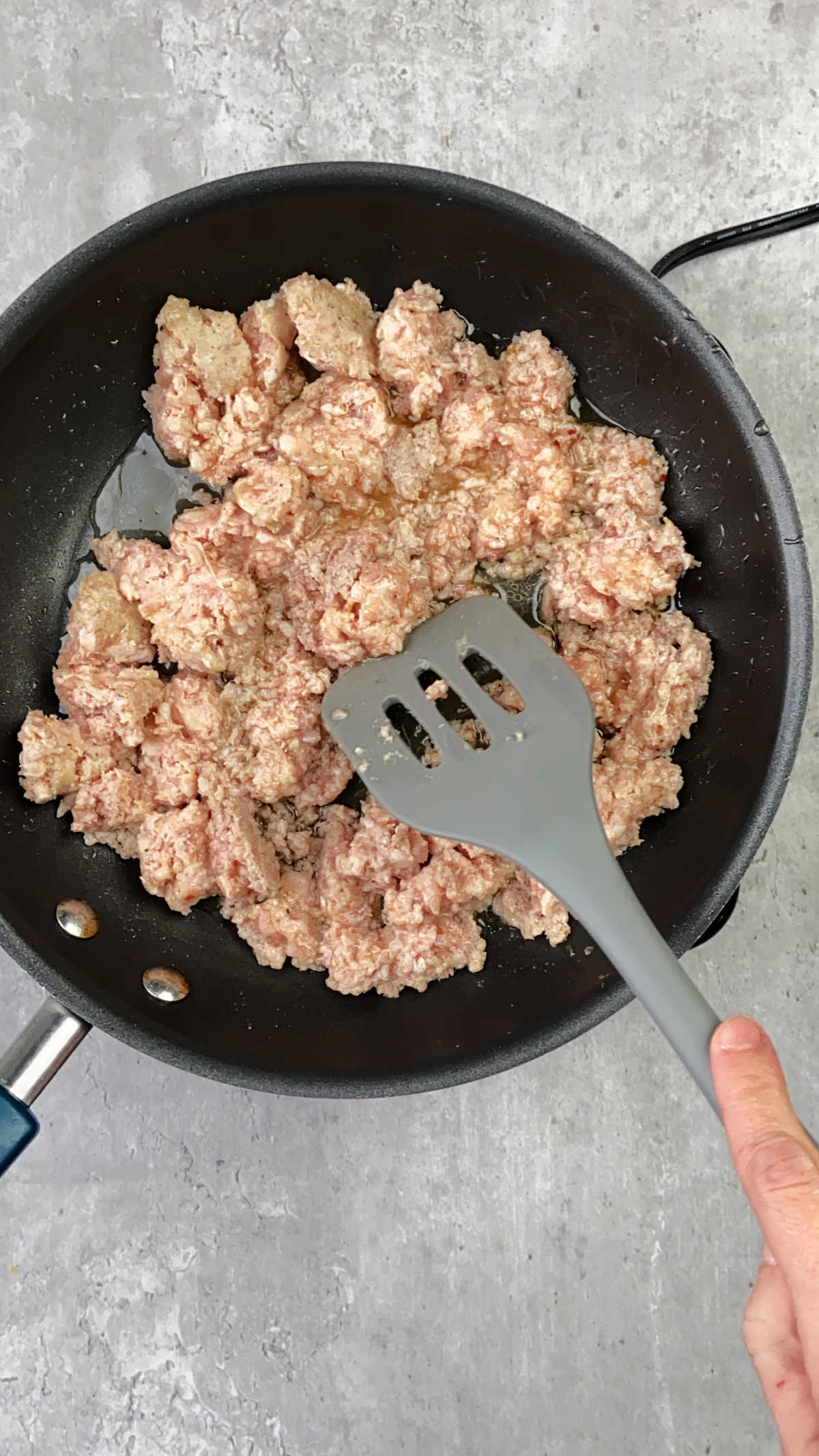 Sausage cooking in a pan. 