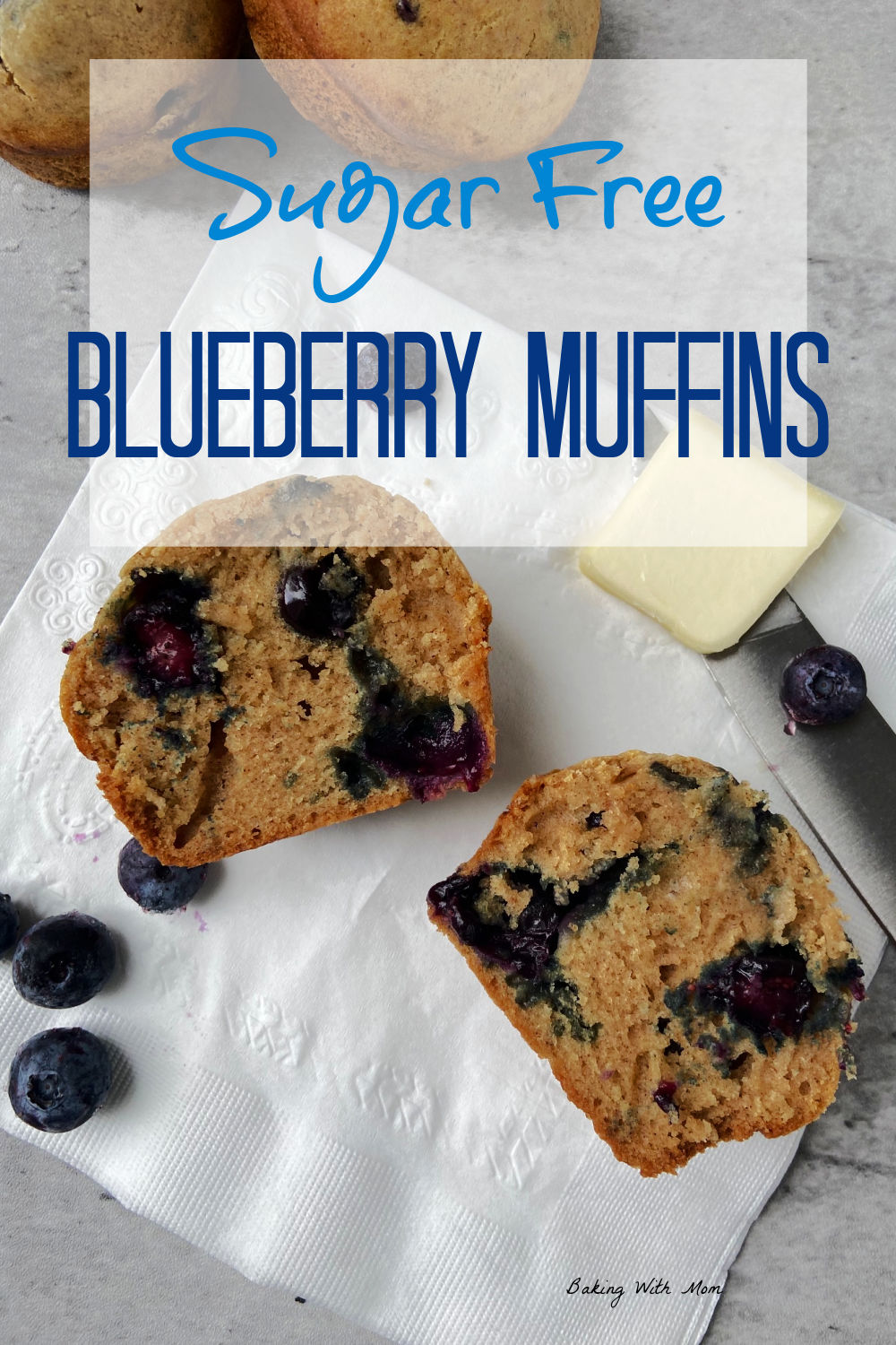 Blueberry muffin cut into half on a white napkin. 