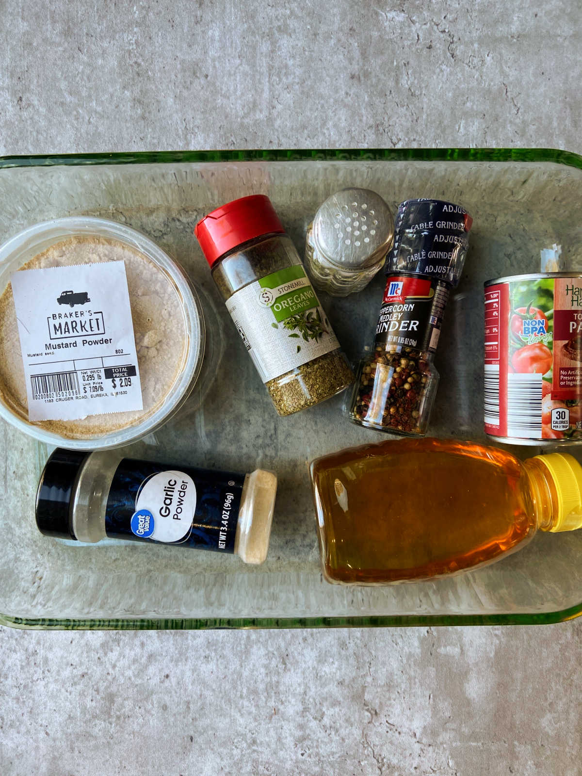 A baking pan holding ingredients for marinade. 