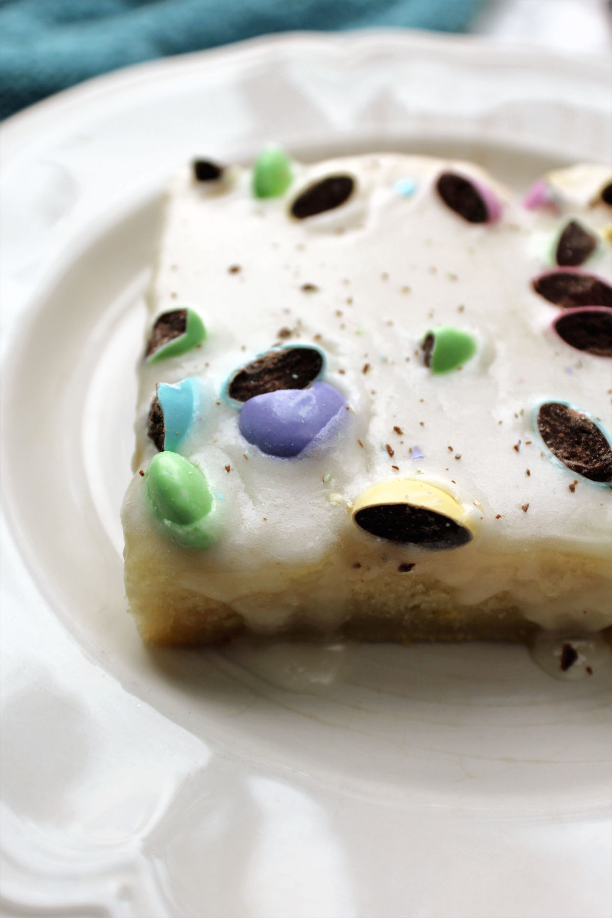 piece of Easter poke cake on a white plate