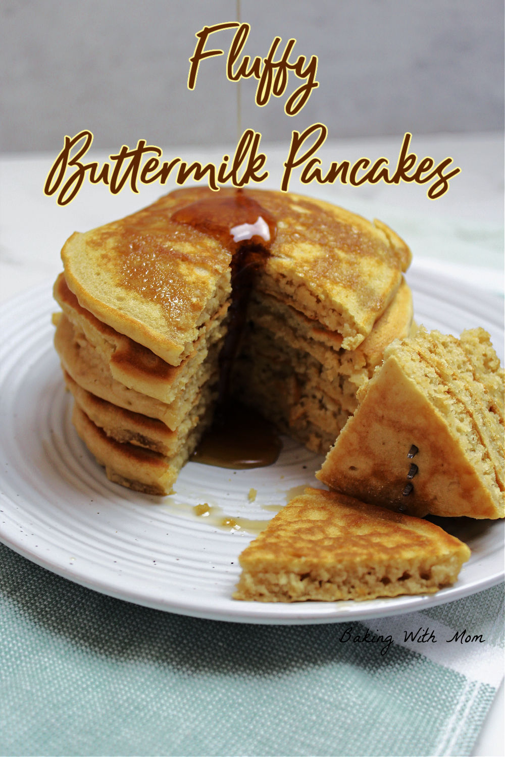 A stack of pancakes with syrup on a white plate. 