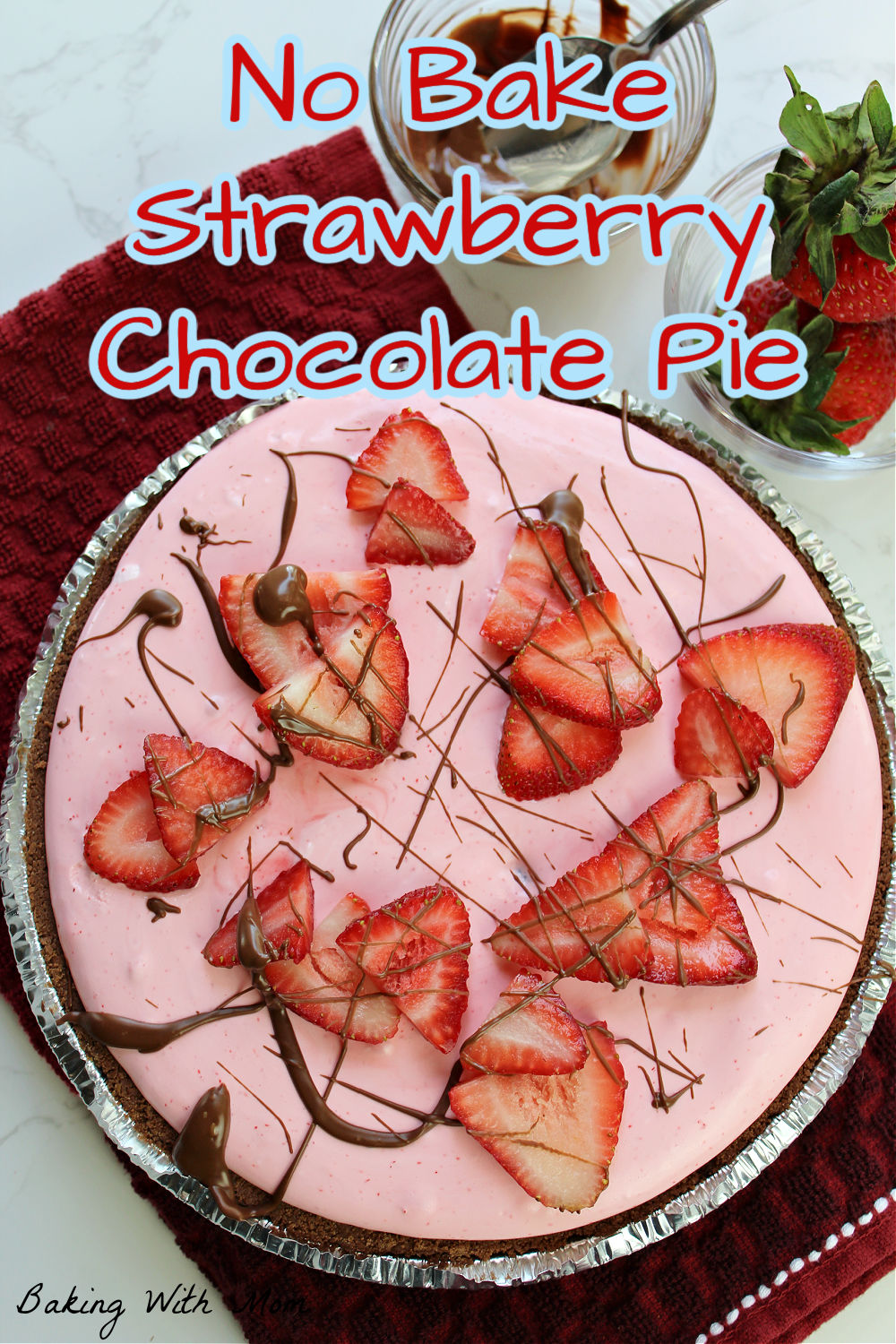 no bake strawberry chocolate pie with strawberries on top and a drizzle of chocolate. 