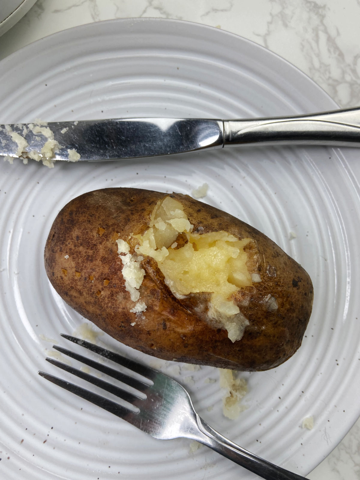 Baked potato with butter melted. 