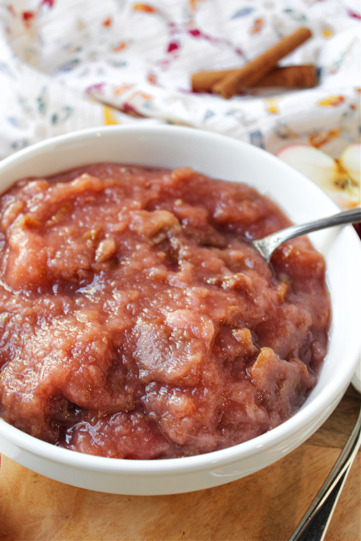 warm applesauce in a bowl with a spoon.