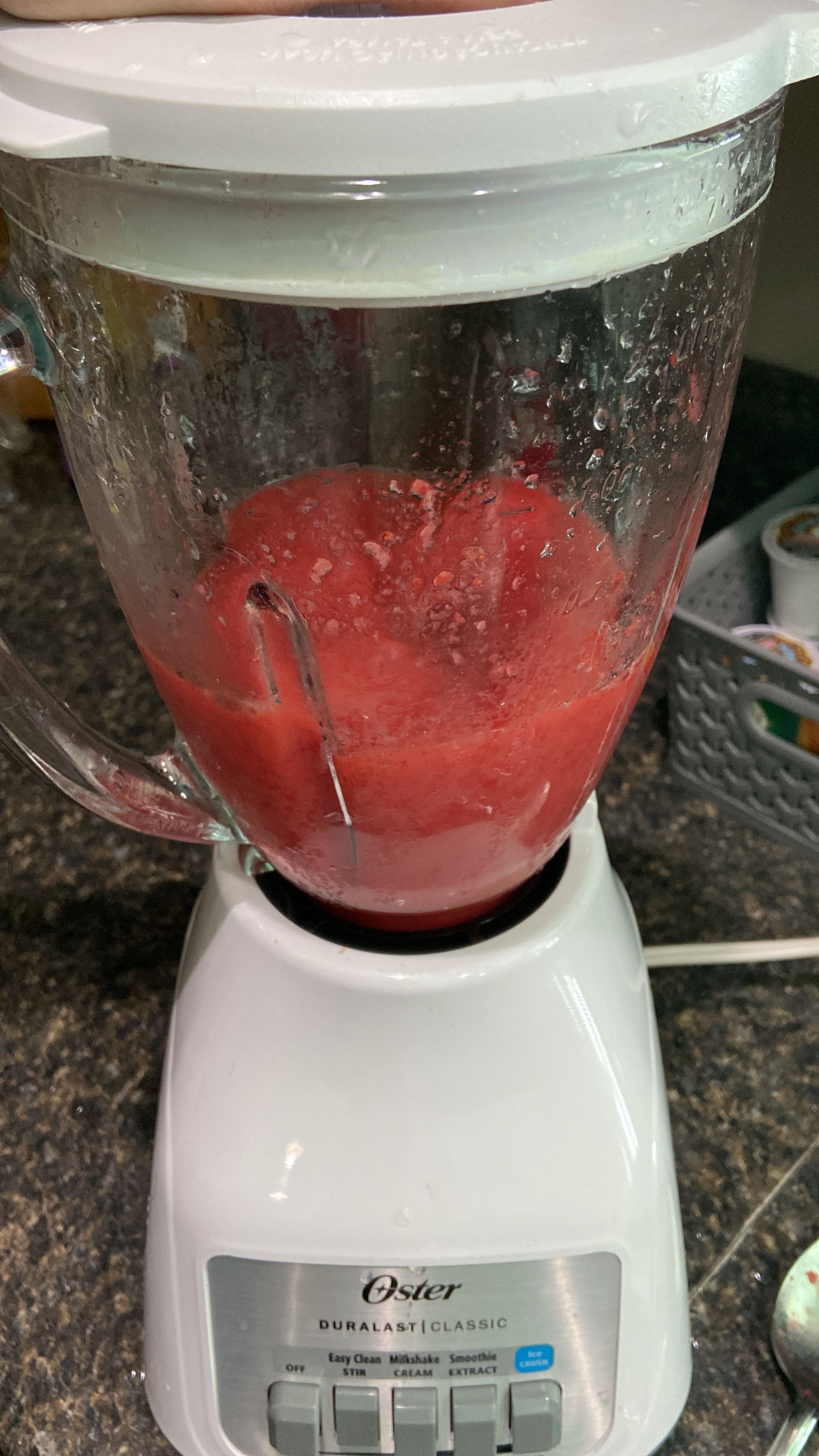 blender with strawberries inside.