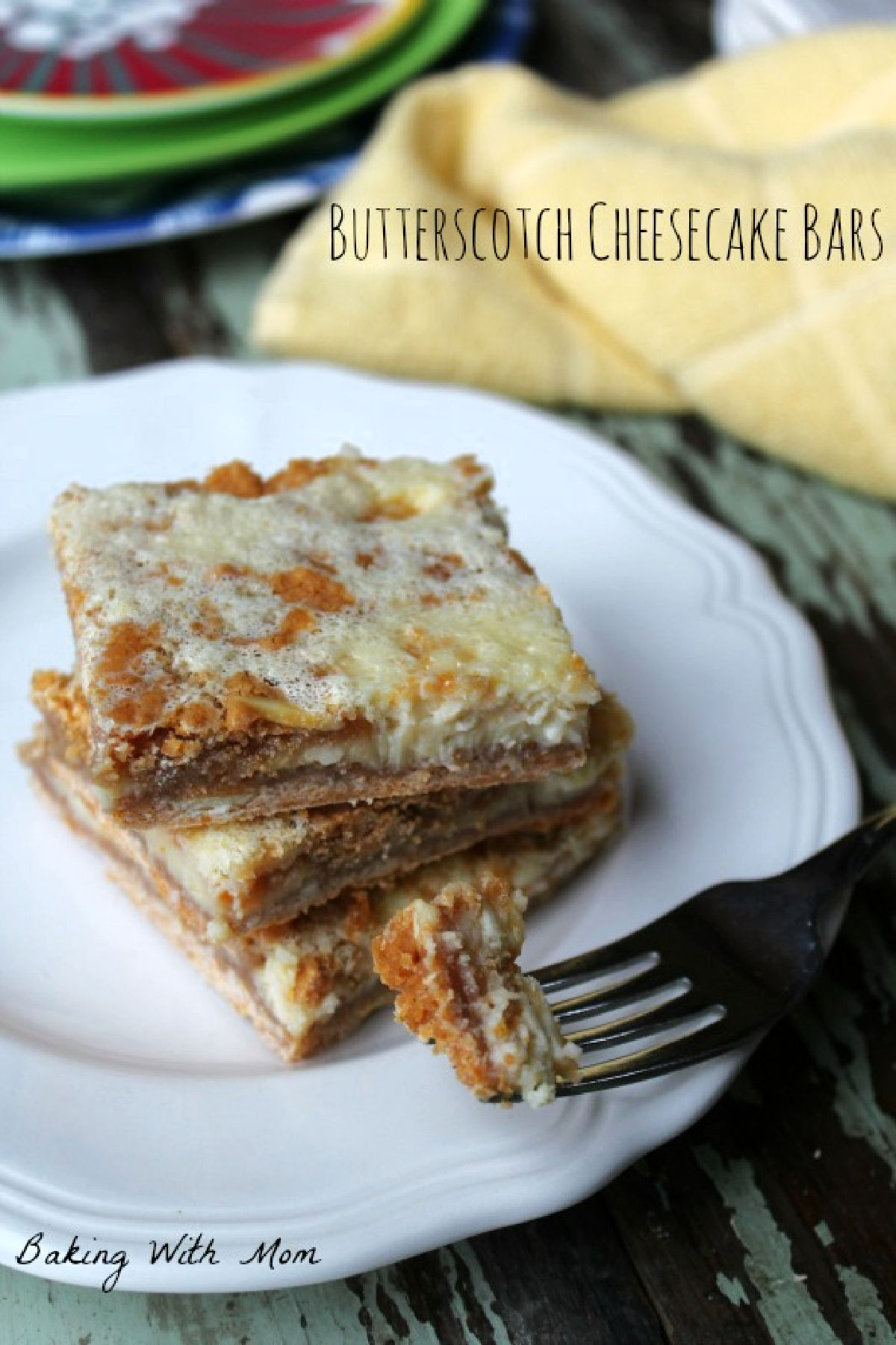 3 butterscotch bars on a white plate with a fork. 