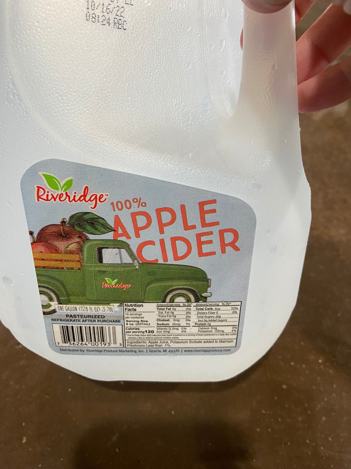 Apple cider jug on a counter. 