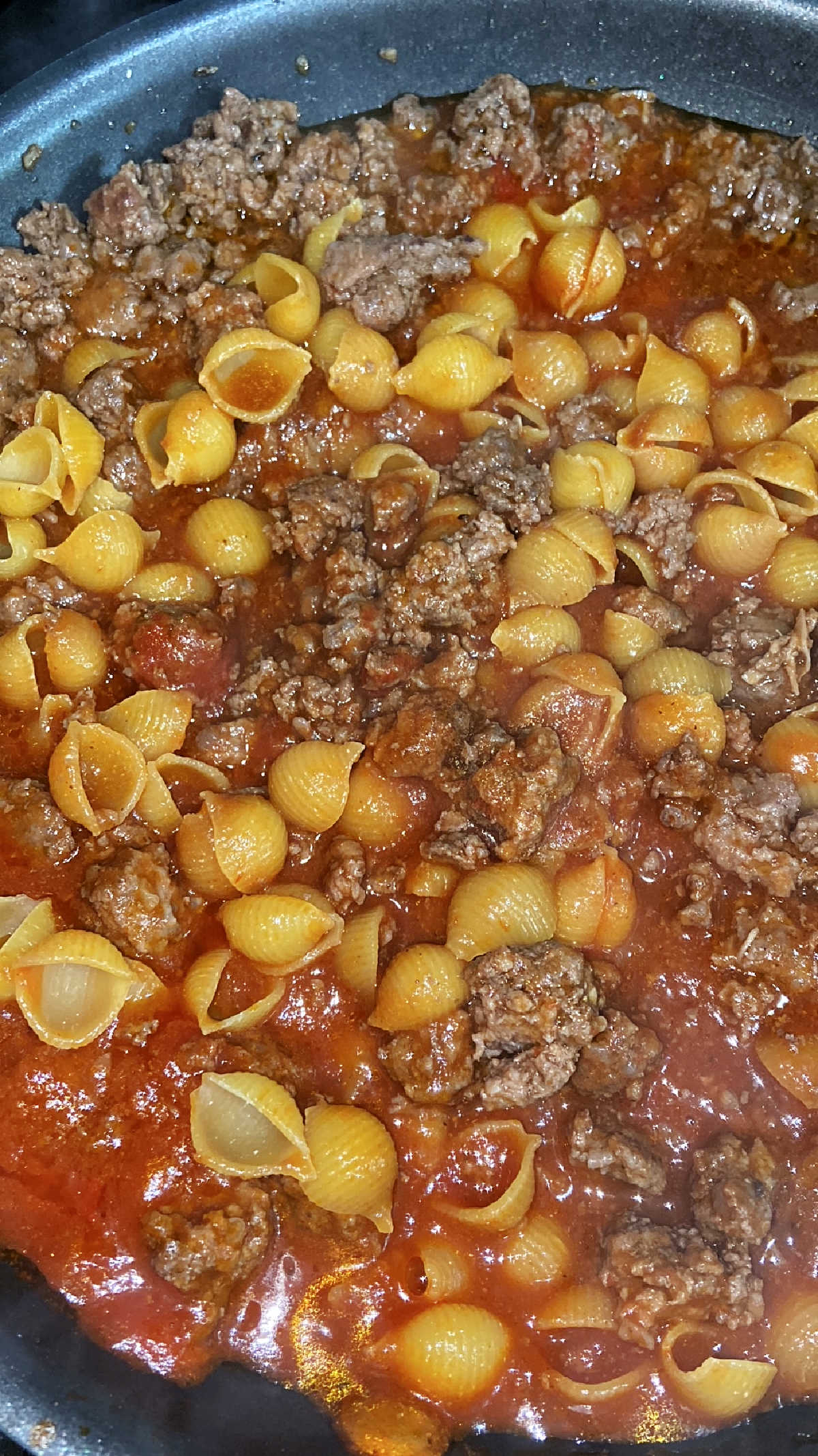 hamburger helper cooking in a pan.