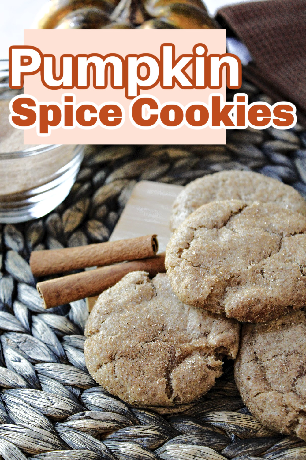 pumpkin spice cookies with cinnamon sticks nearby.