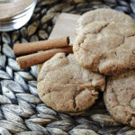 3 pumpkin spice cookies on a brown mat.