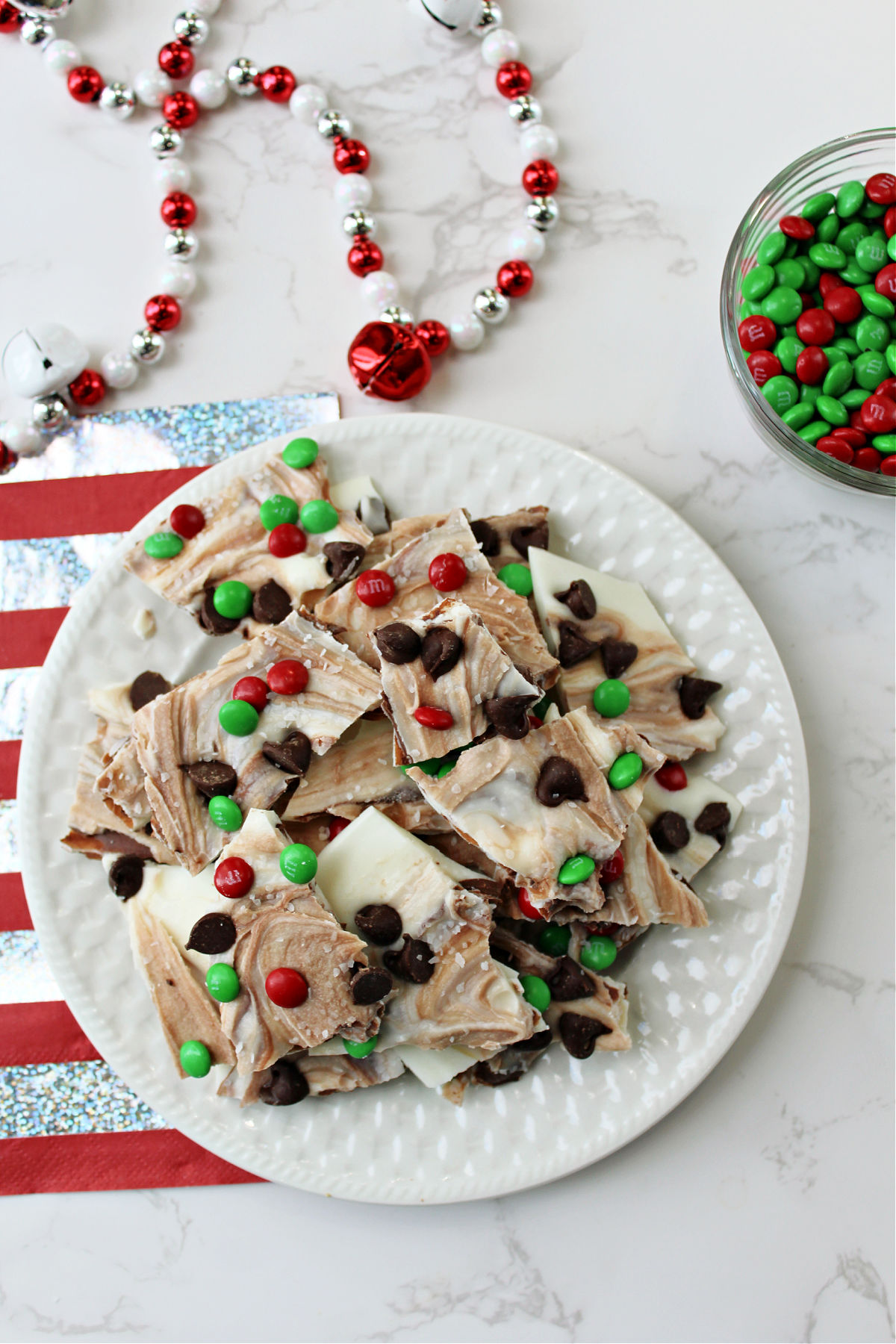 chocolate almond bark candy on a white plate.