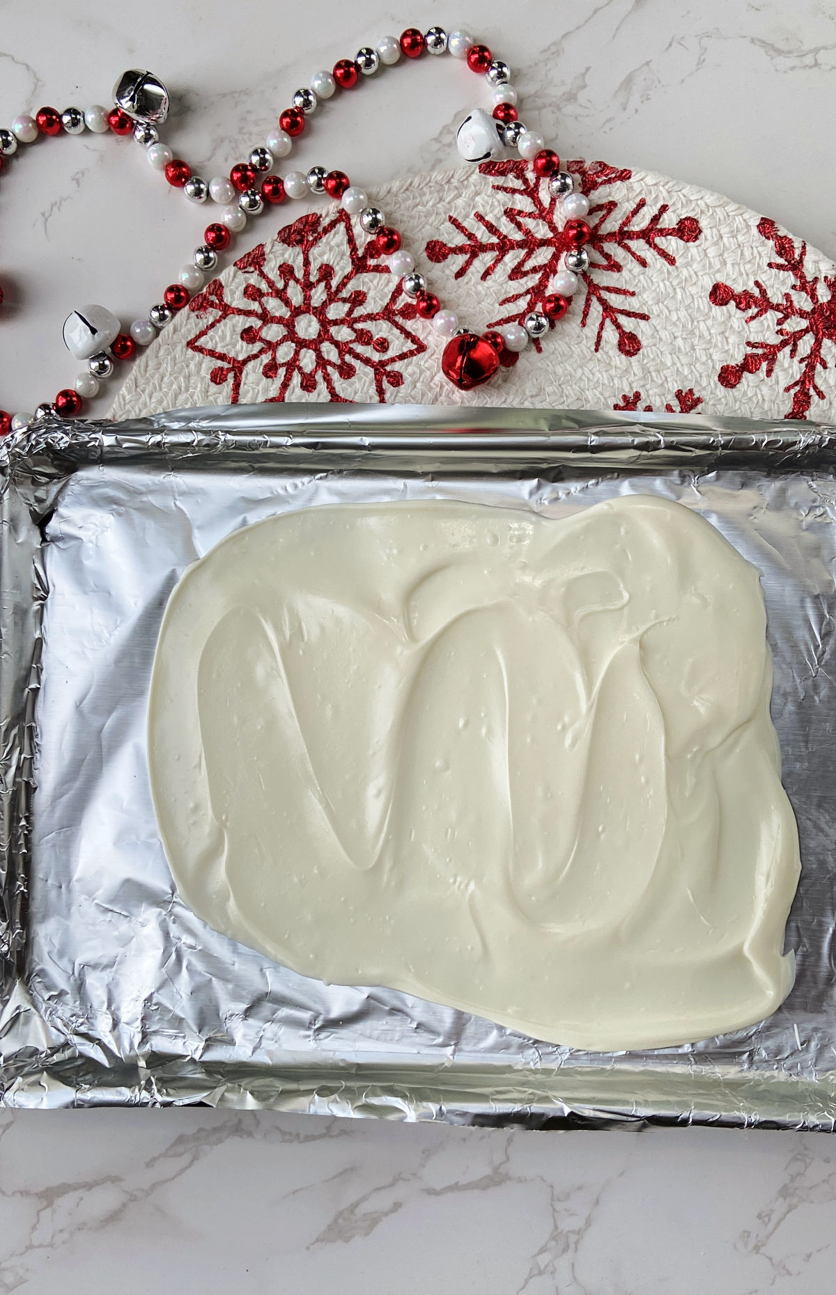 melted almond bark on a baking sheet.