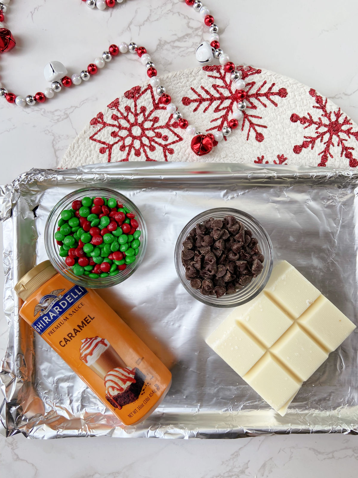 almond bark, caramel and chocolate on a baking sheet. 