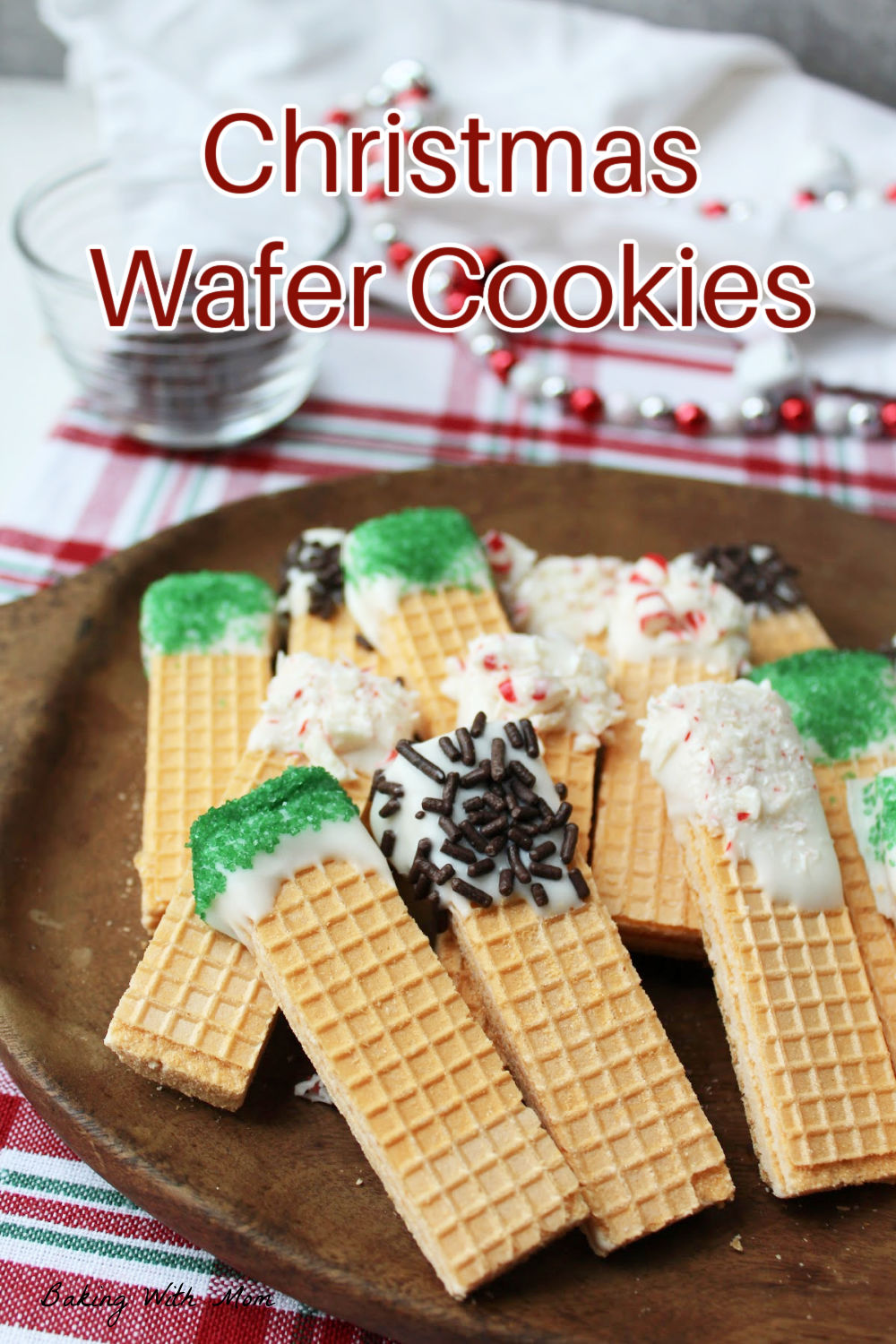 Christmas wafer cookies on a brown plate. 
