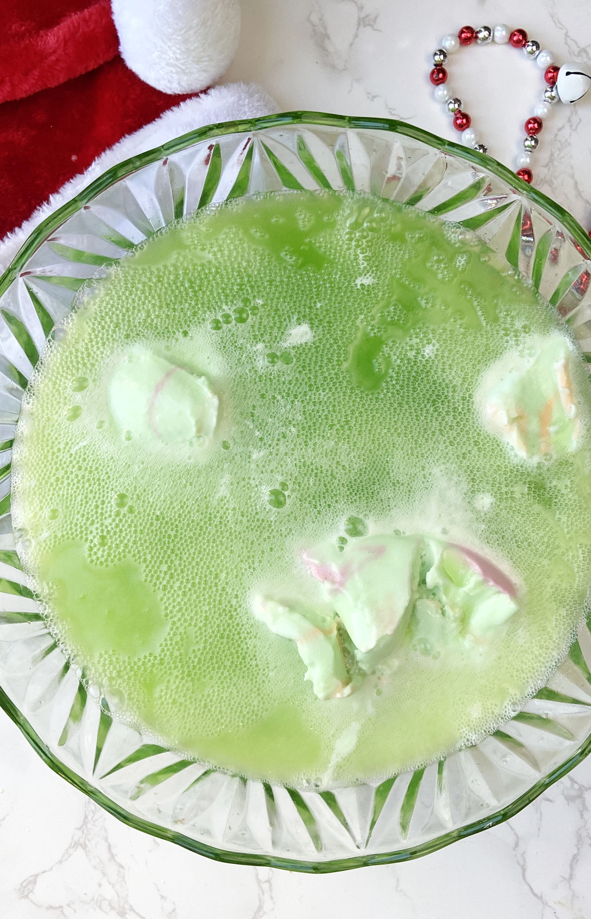 Sherbet in a punch bowl with green punch. 