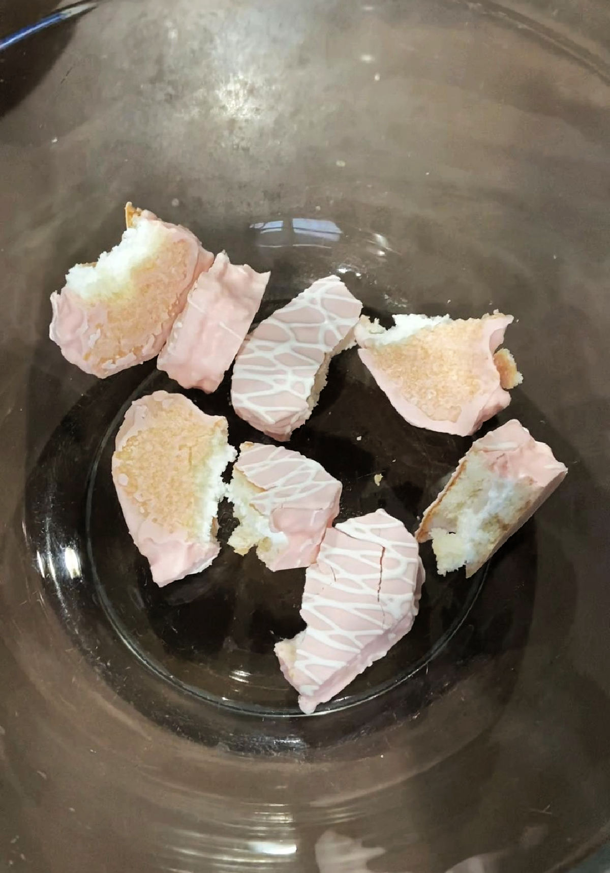 broken snack cake hearts in a clear bowl. 