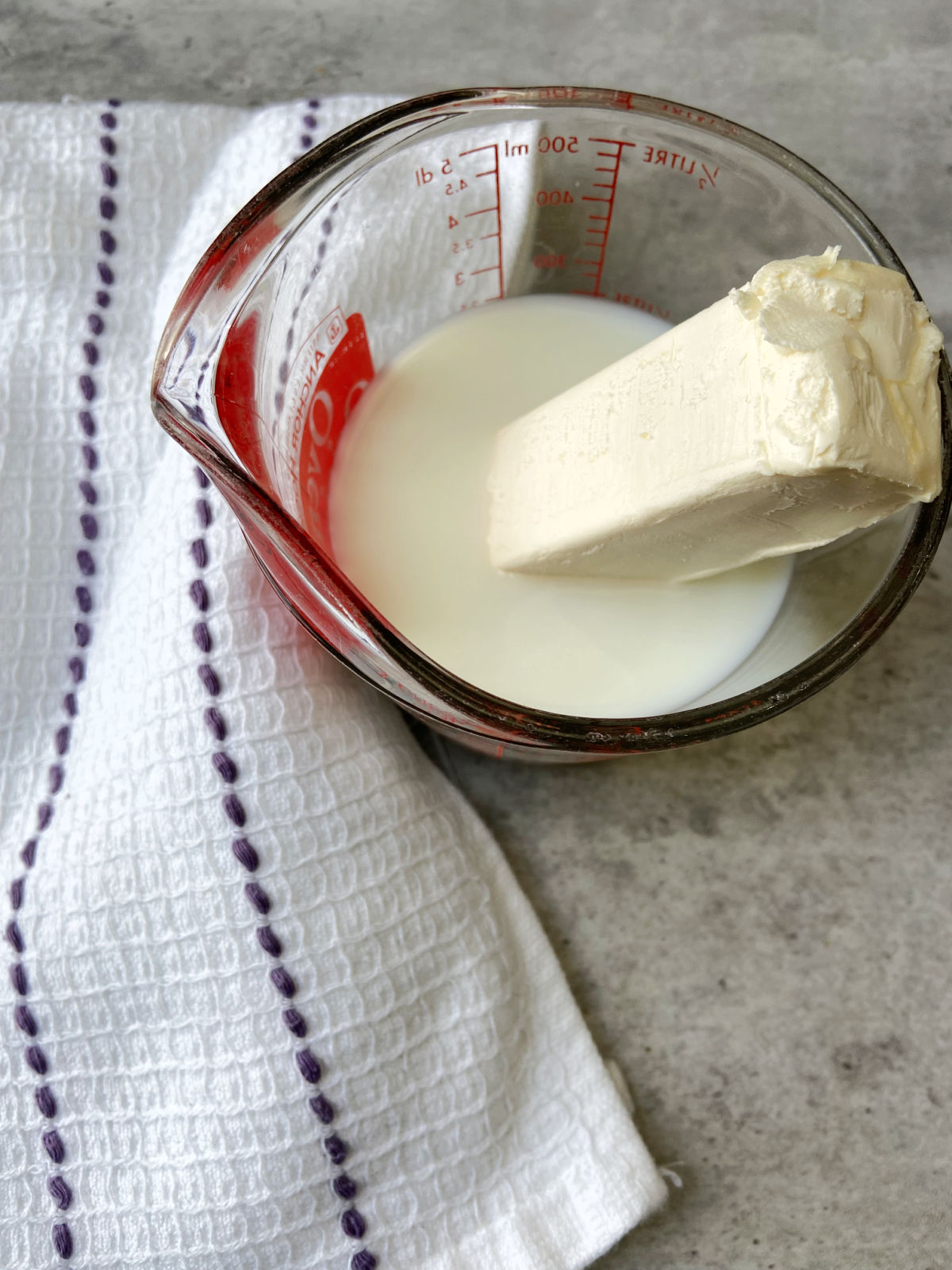 butter and milk in a measuring cup. 