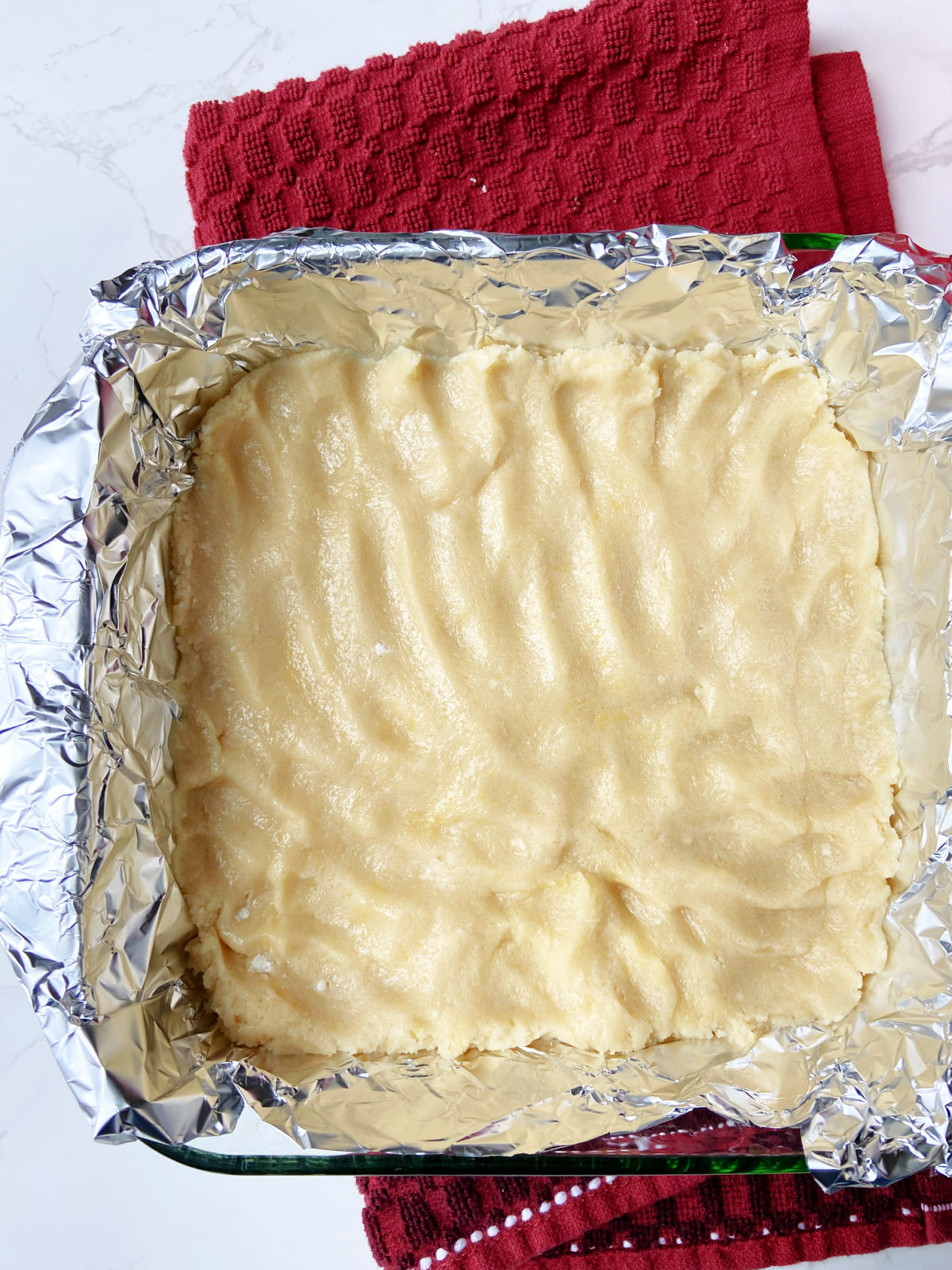 lined pan with cookie dough on top. 