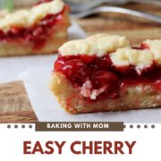 Easy Cherry Bars on a brown board with forks behind.