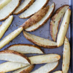 ranch potato wedges on a cooking sheet.