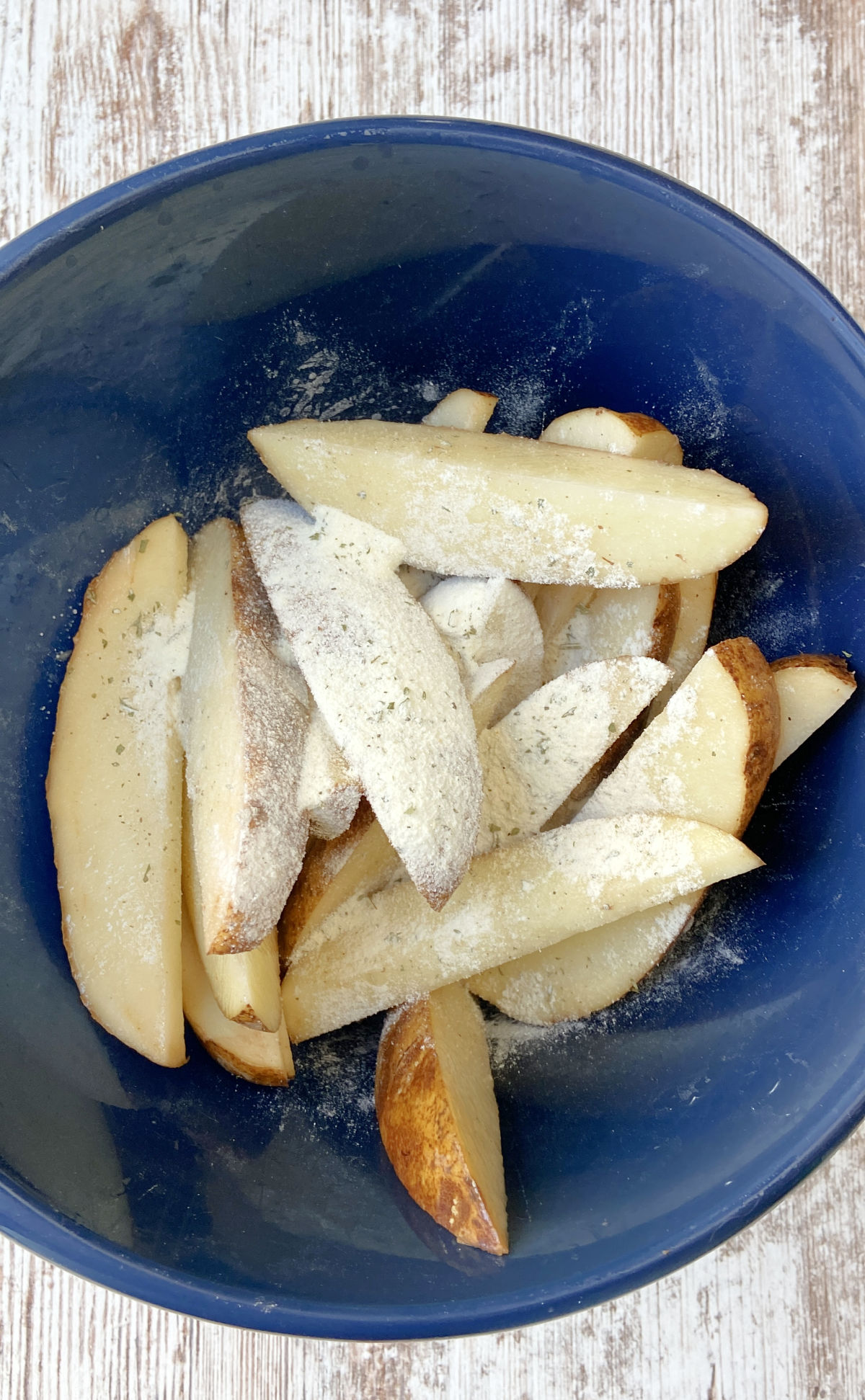 potato wedges with ranch dry dip on top. 