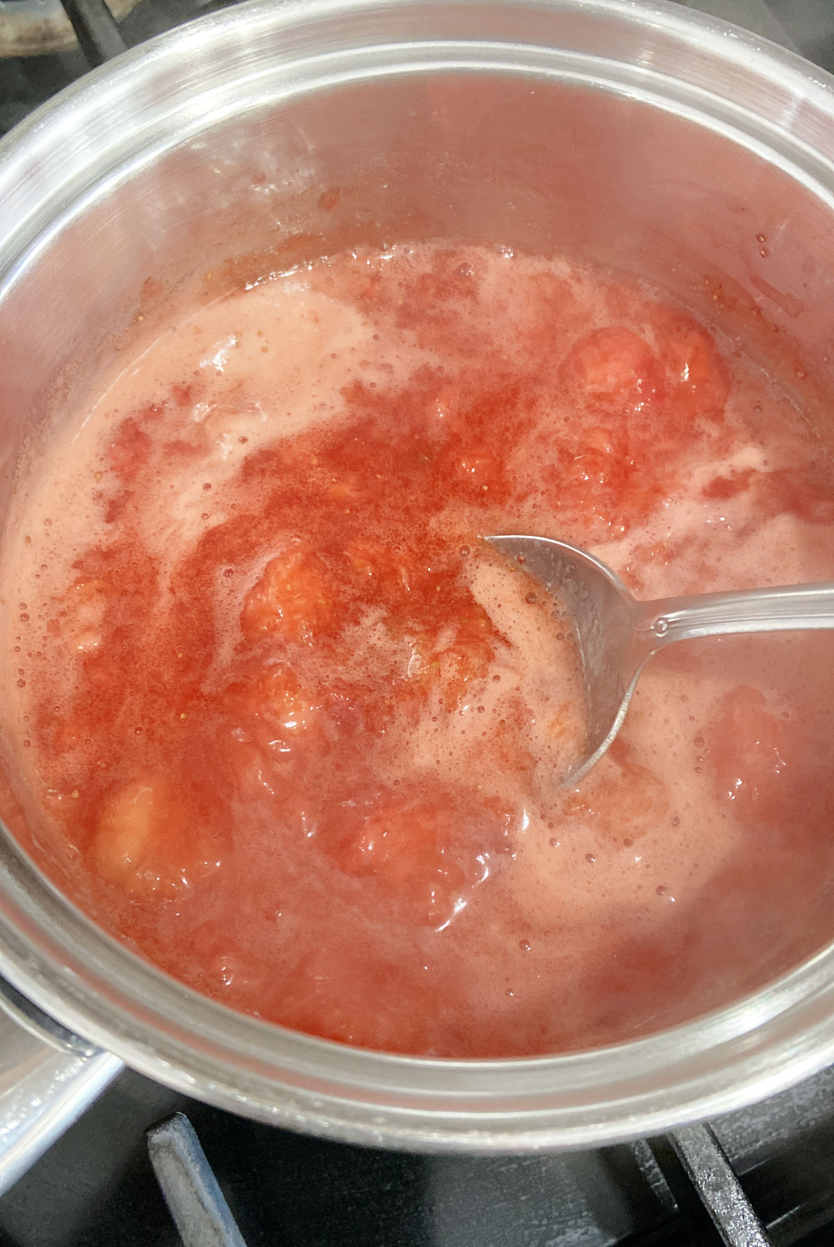 thickening strawberries in a pan. 