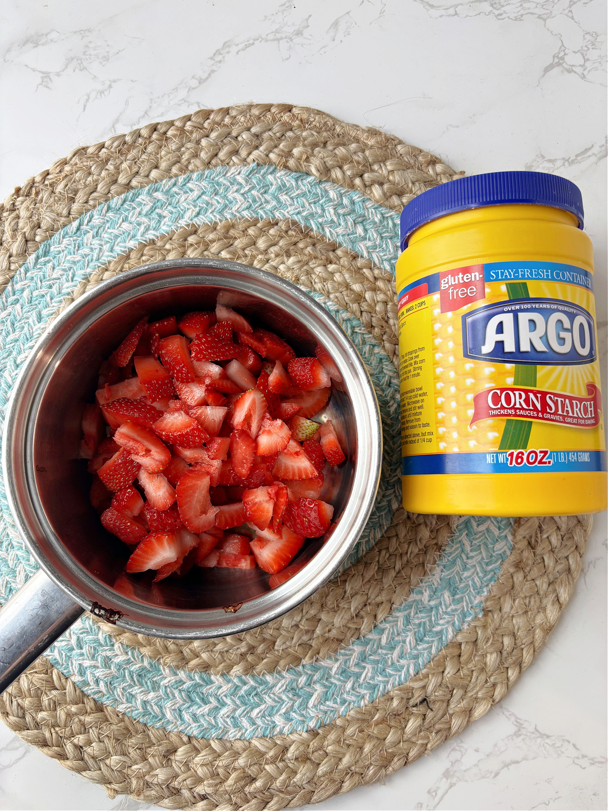 strawberries in a pan and cornstarch.