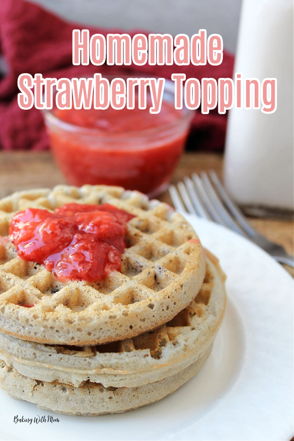 waffles on a white plate with strawberry sauce on top. 