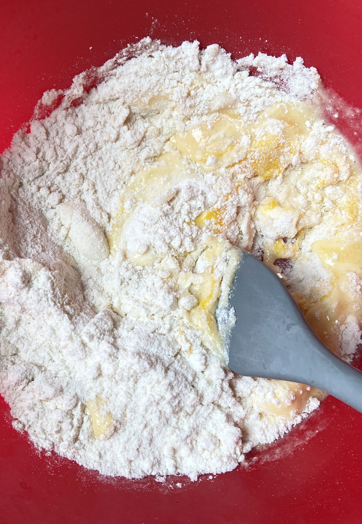 sugar cookie mix in a red bowl. 