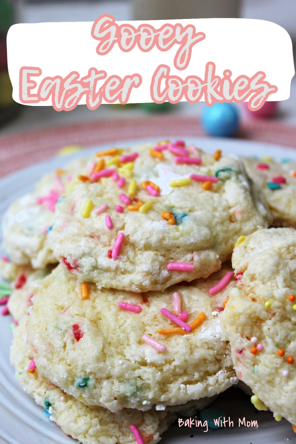 Gooey Easter cookies on a white plate with sprinkles on top. 