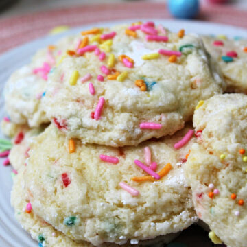 Gooey Easter cookies on a plate with sprinkles.