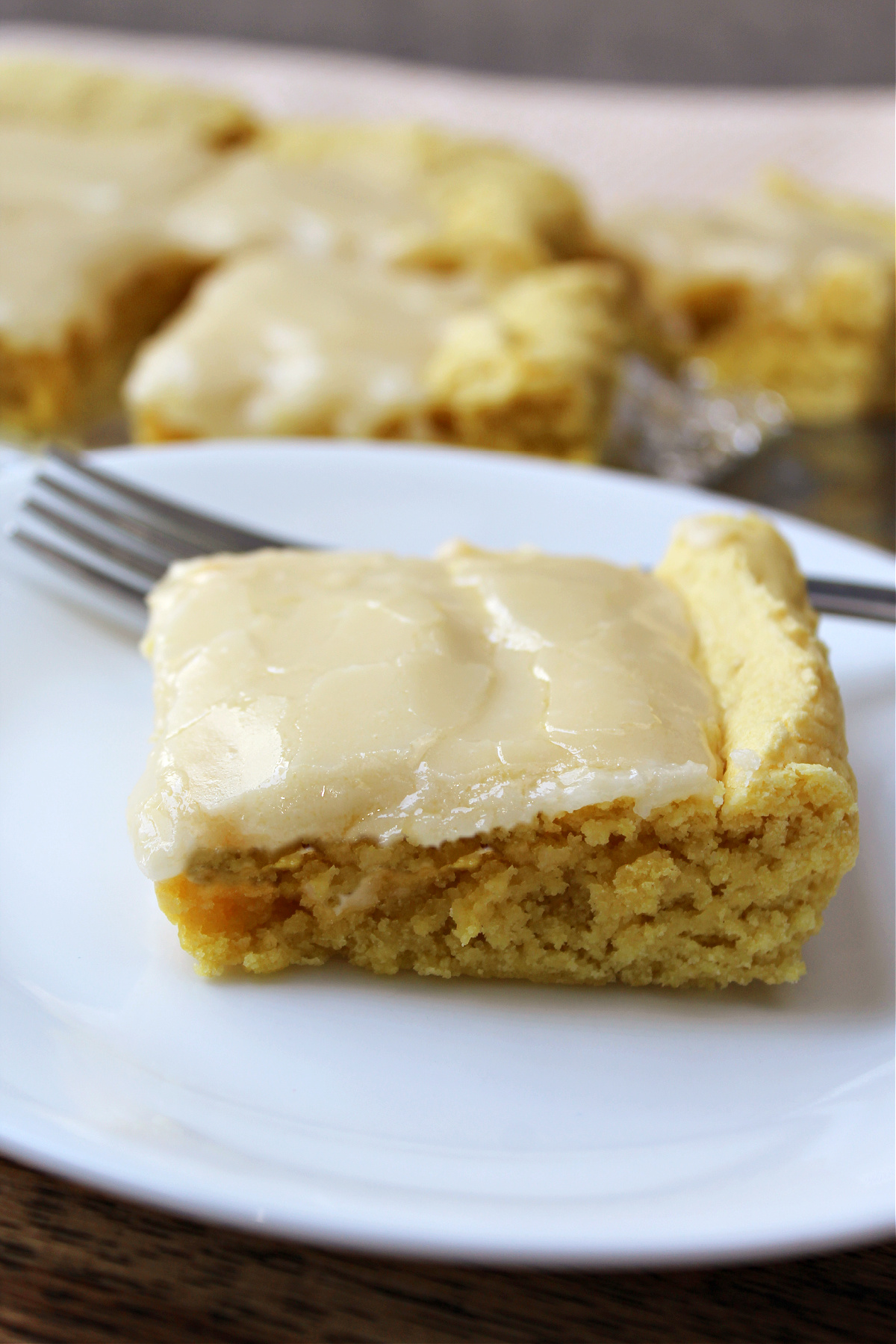 Lemon brownie on a white plate. 