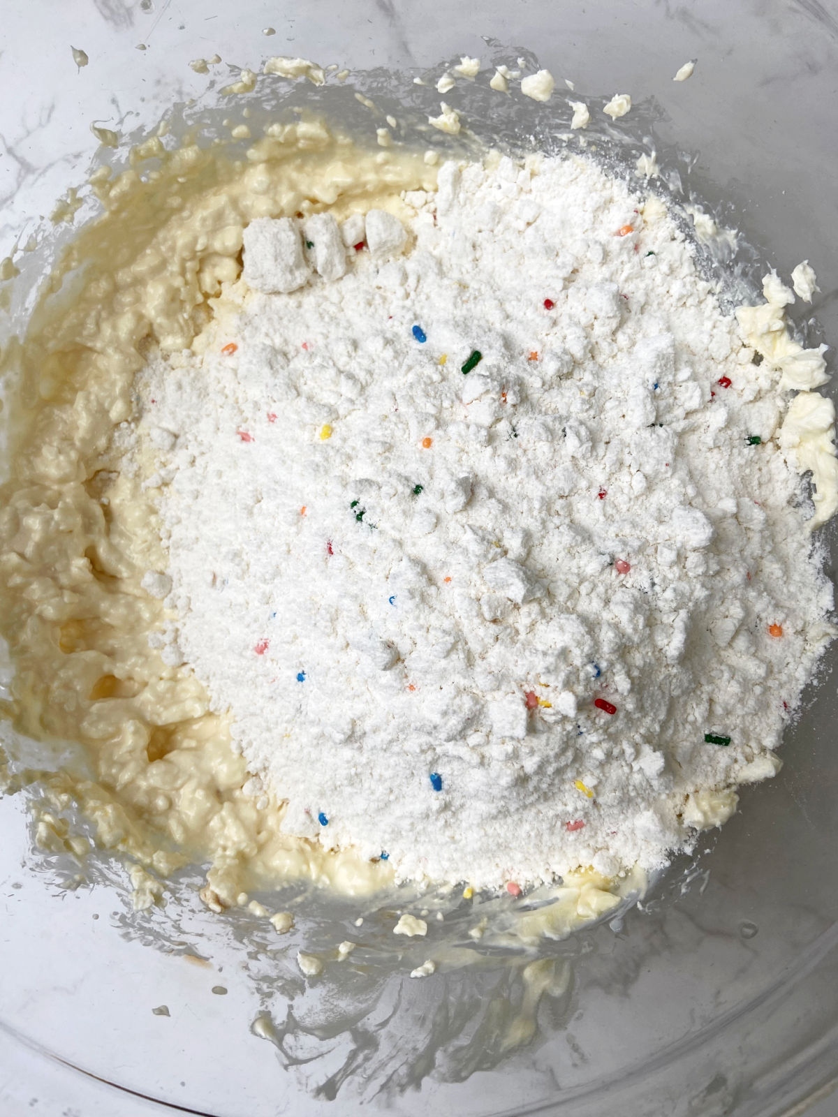 cake mix in a clear bowl. 