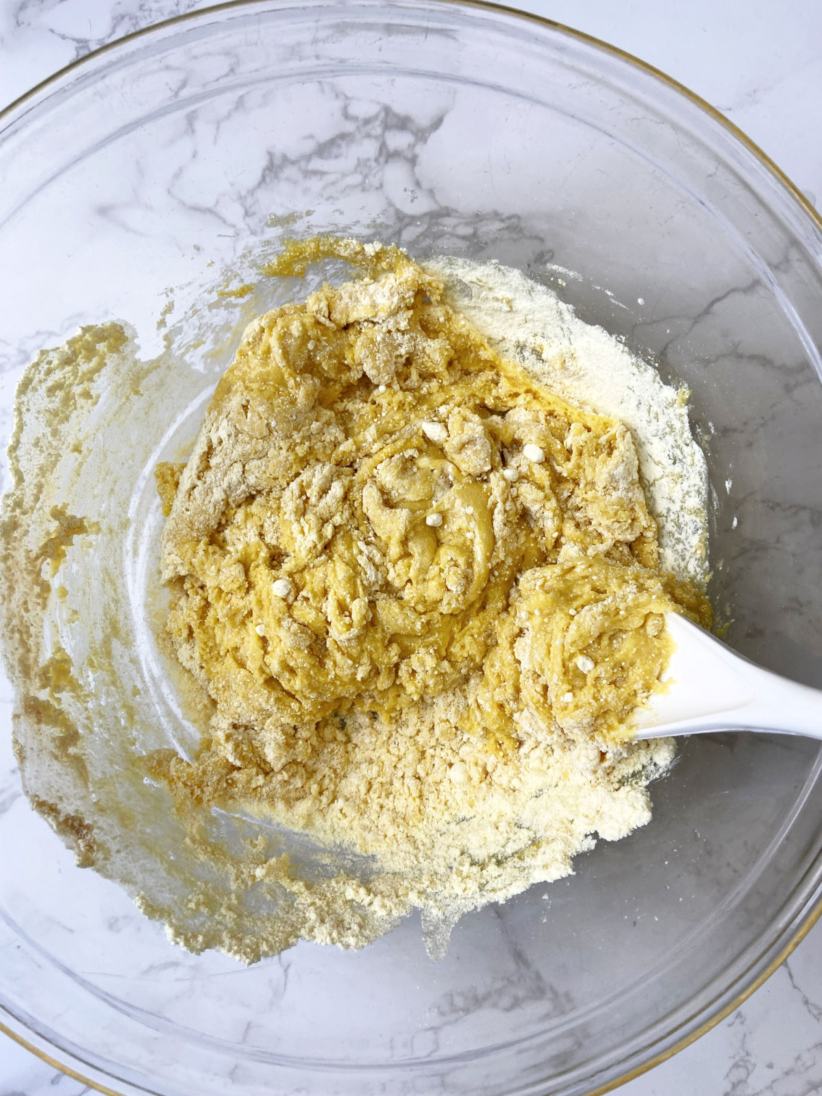 lemon cake mix in a clear bowl. 