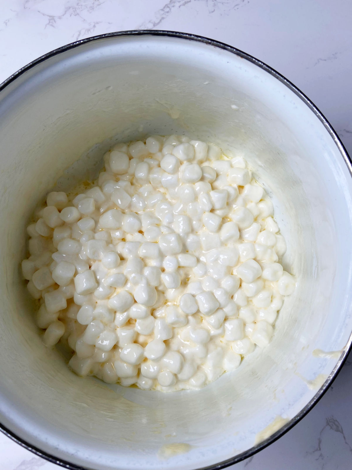 melting marshmallows in a pot. 