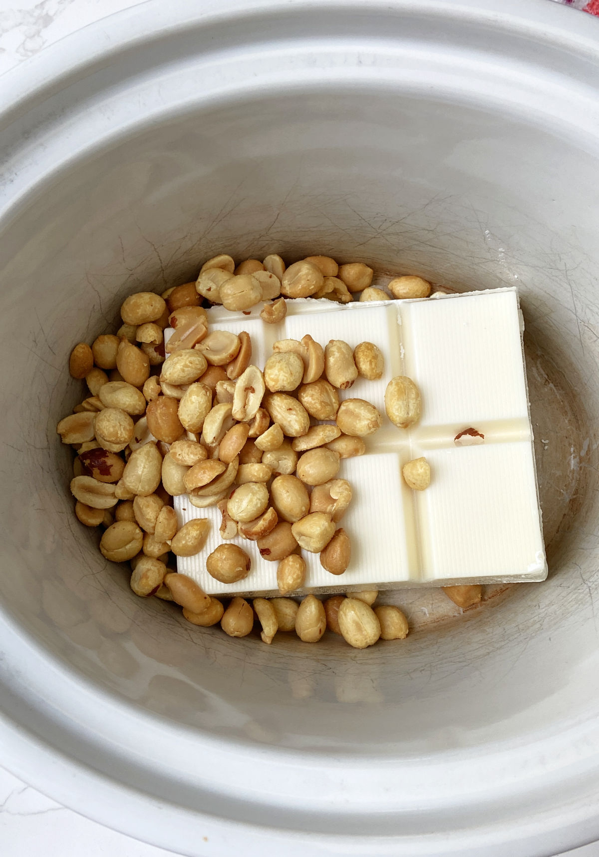 peanuts and almond bark in a crock pot. 