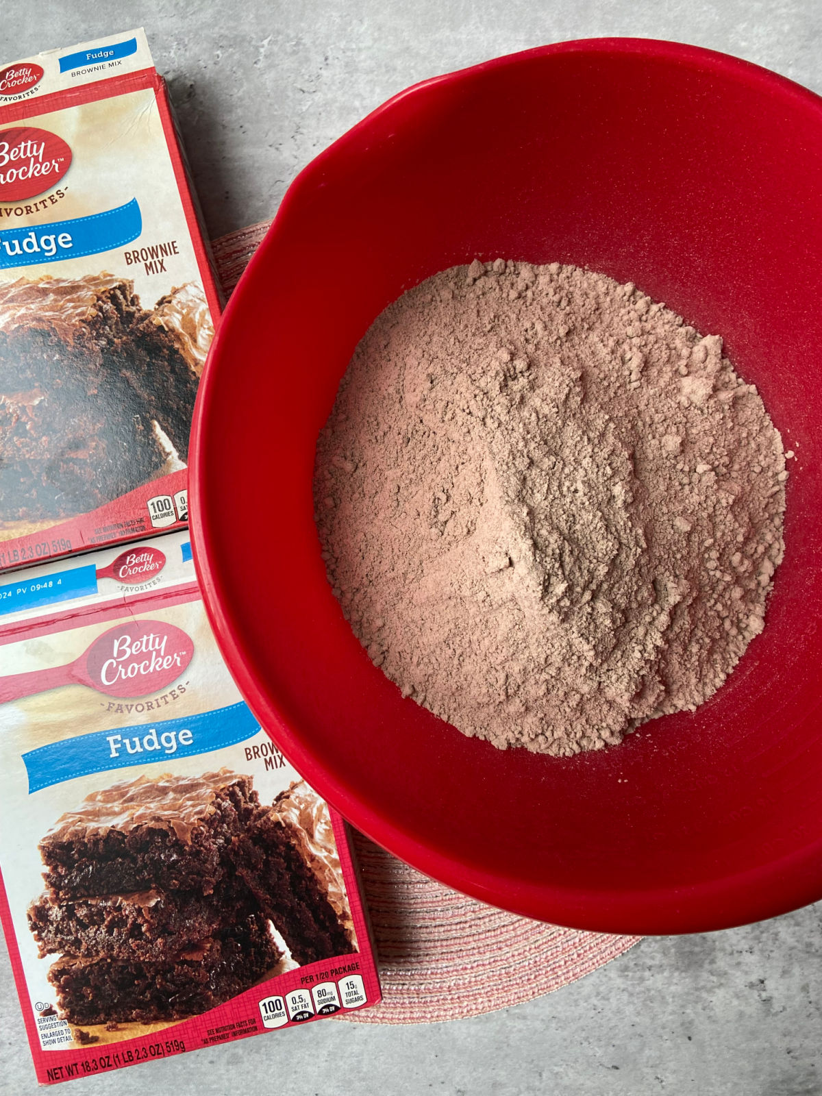 brownie mix in a red bowl. 