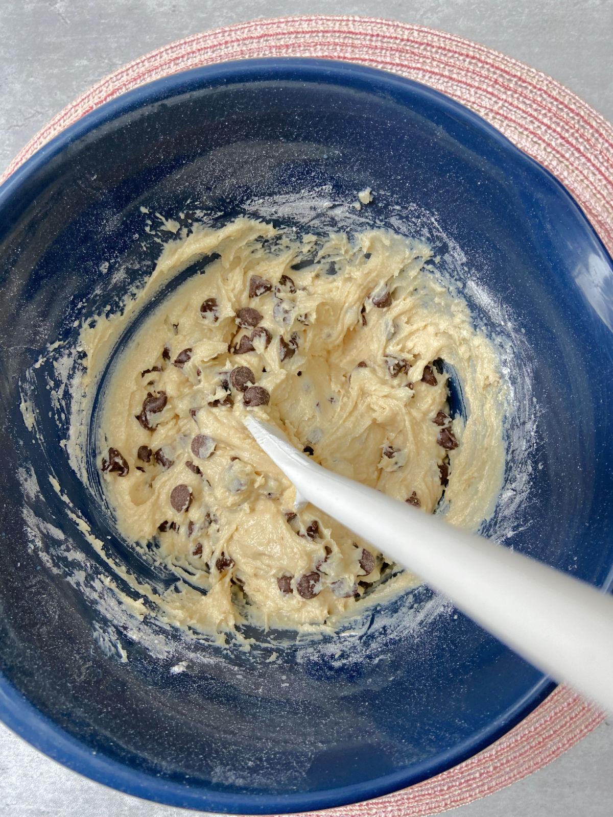 Cookie dough in a blue bowl. 