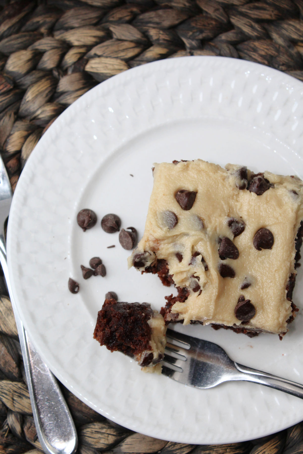 brownie on a white plate with a fork. 