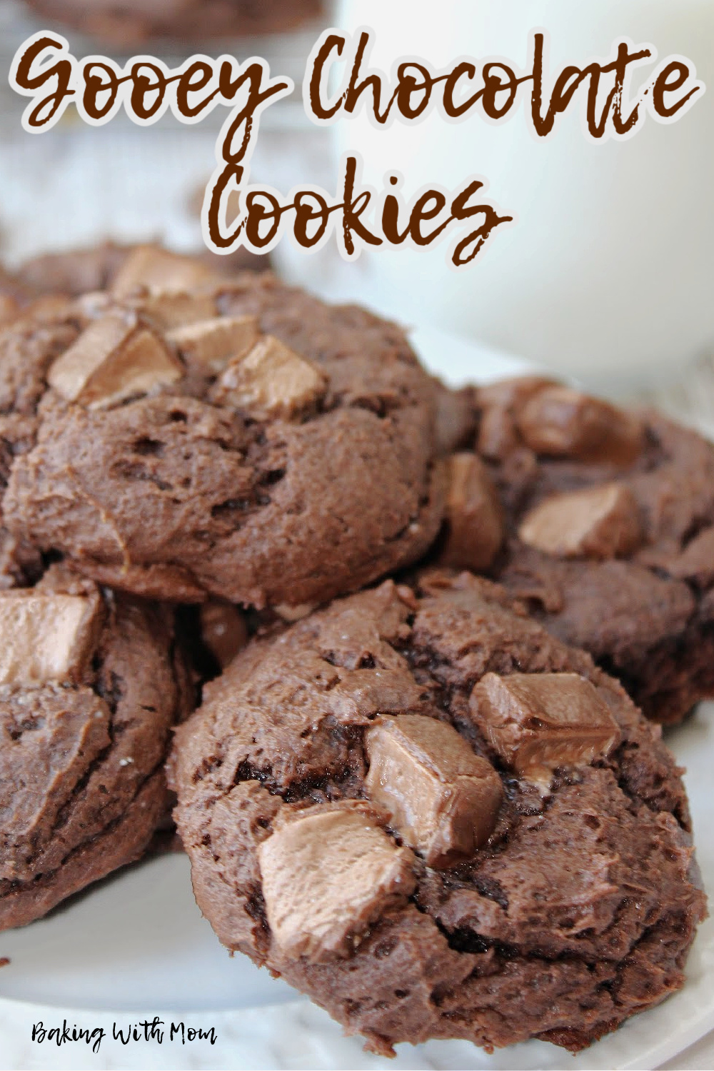 Gooey chocolate cookies on  plate with milk. 