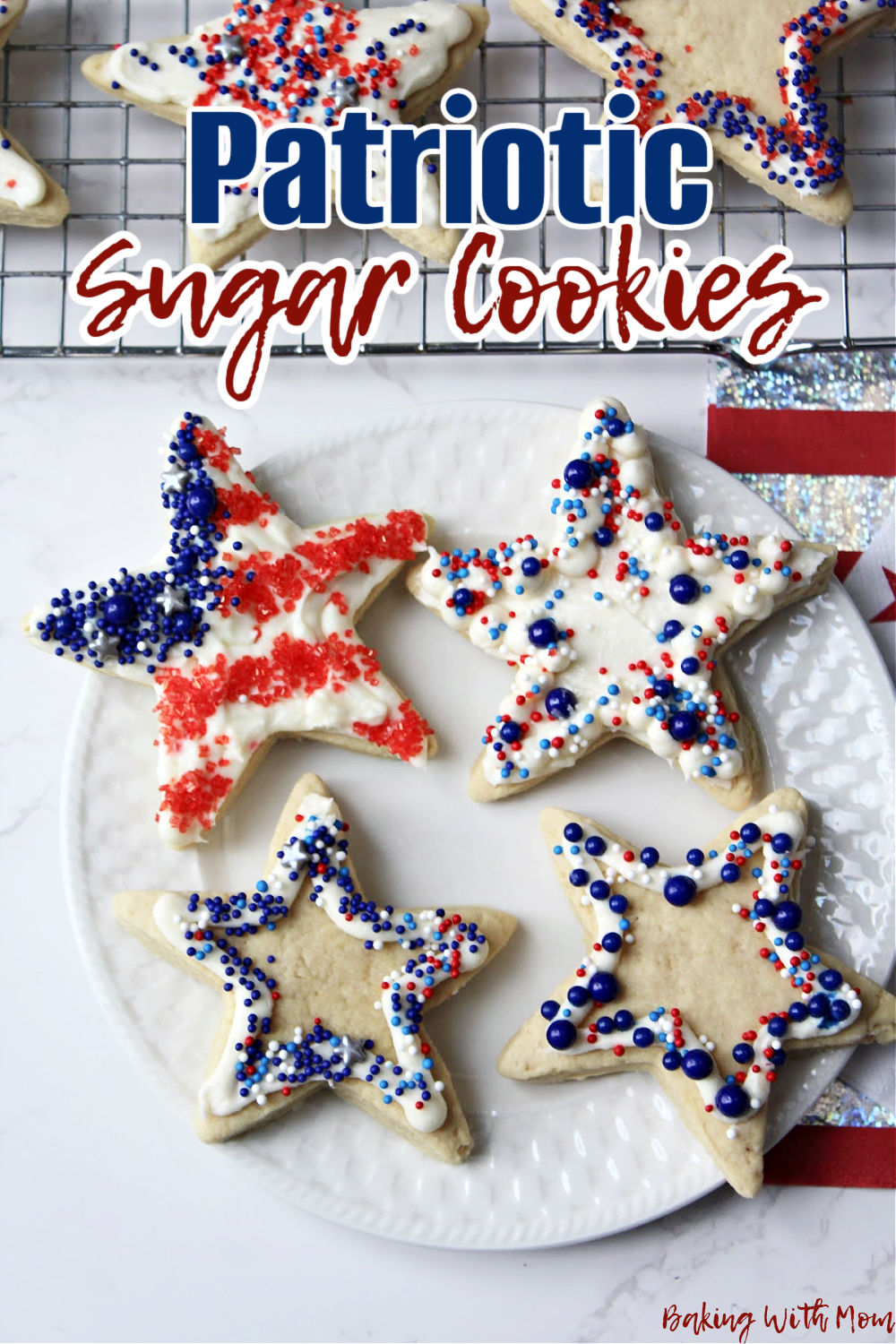 Patriotic sugar cookies on a white plate.