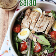 salad on a colored towel in a white bowl.