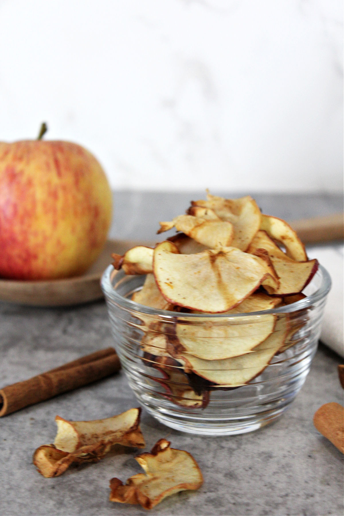 apple chips in a clear bowl. 