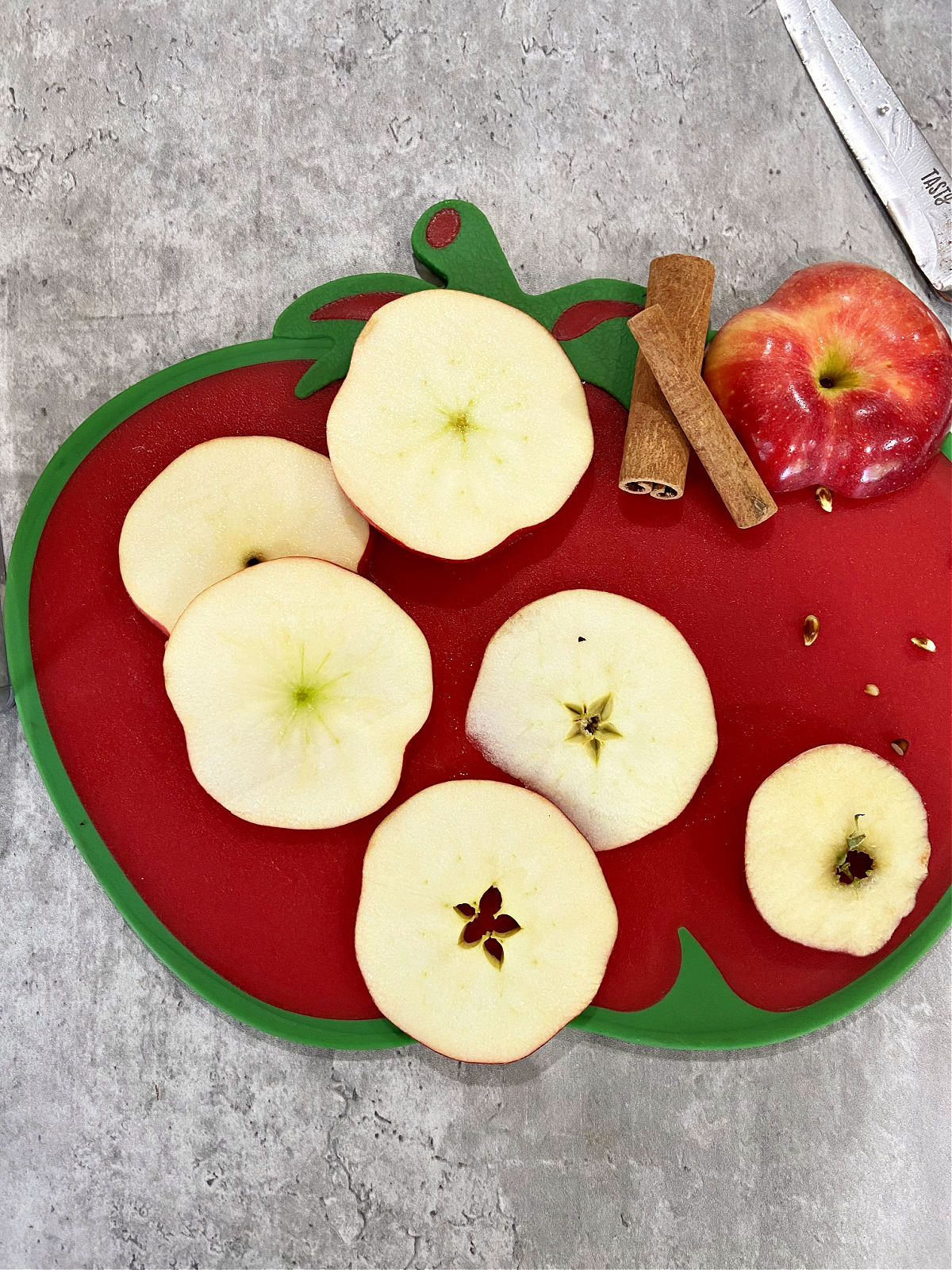 apple slices on a cutting board. 